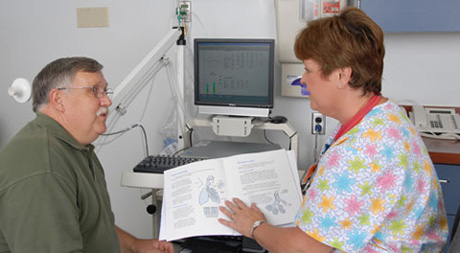 Nurse discussing lung and pulmonary treatments with patient